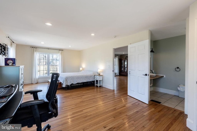 bedroom featuring recessed lighting, baseboards, and light wood finished floors