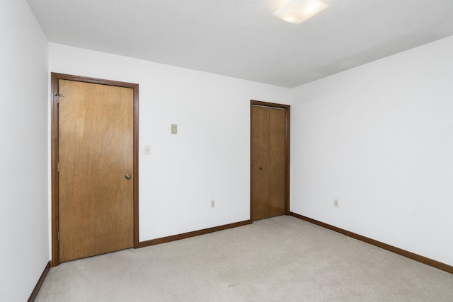 empty room with light colored carpet