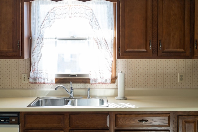 kitchen featuring dishwasher and sink