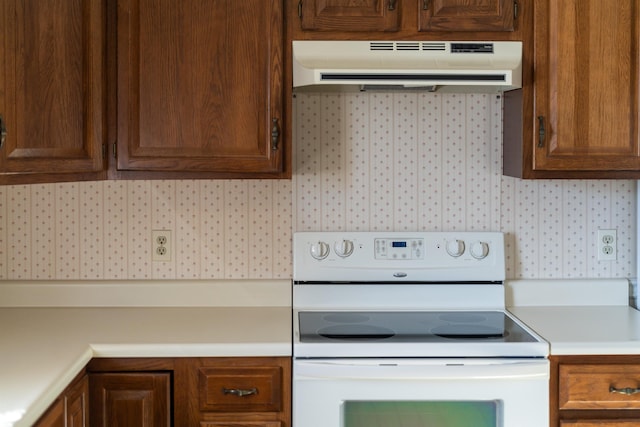 kitchen featuring white electric range oven