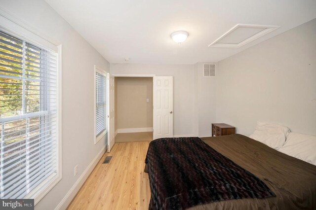 bedroom with light wood-type flooring