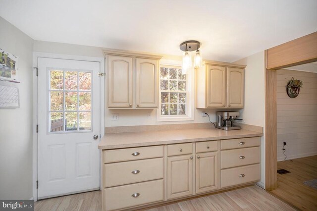 kitchen featuring plenty of natural light and light hardwood / wood-style floors