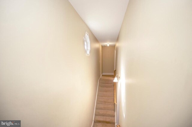 stairway featuring baseboards