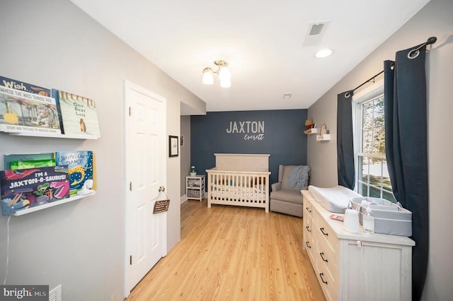 bedroom with light hardwood / wood-style floors