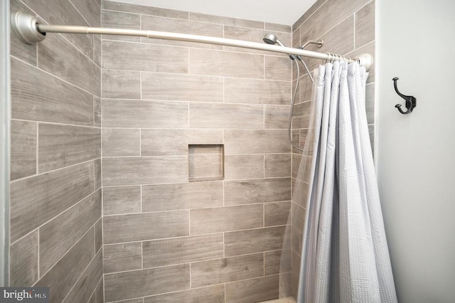 bathroom with a shower with shower curtain