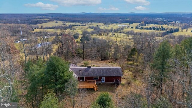 birds eye view of property with a mountain view and a rural view