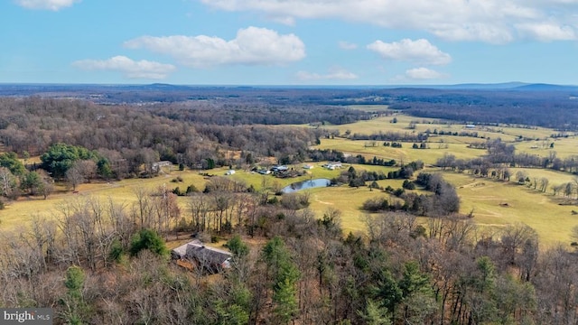 birds eye view of property with a water view and a rural view