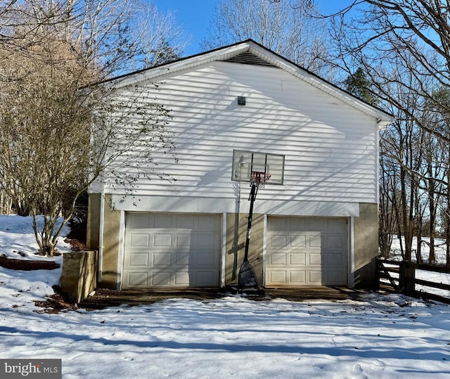 view of snow covered garage