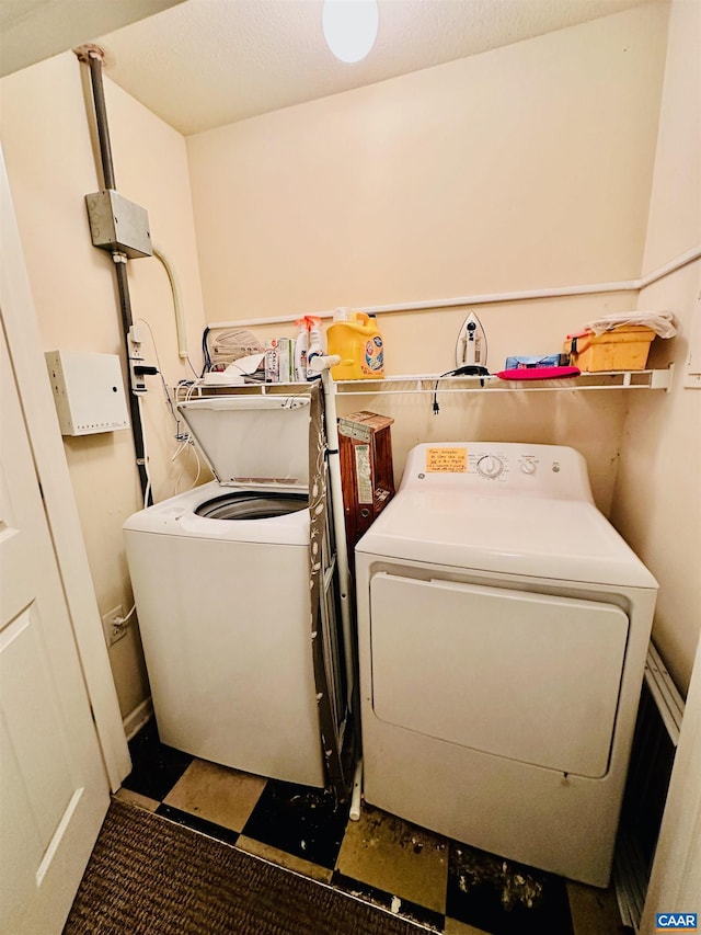 laundry room with independent washer and dryer