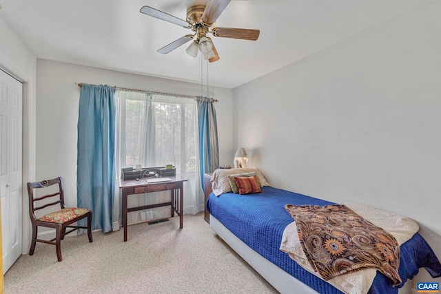bedroom featuring carpet floors, ceiling fan, and visible vents