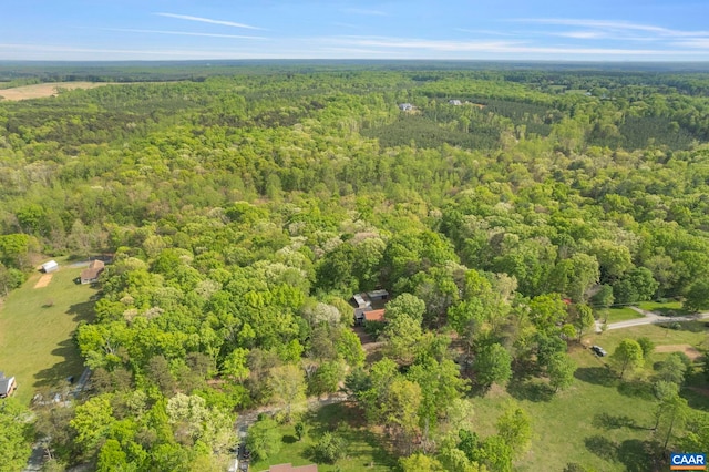 drone / aerial view featuring a forest view