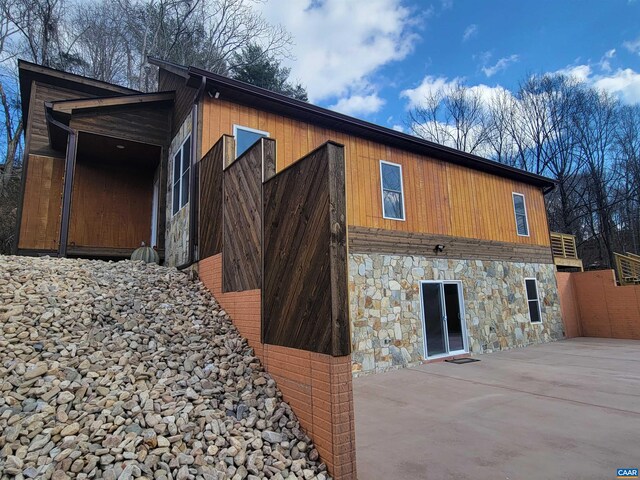 view of side of property with a patio