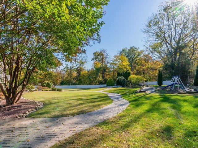 view of property's community featuring a yard