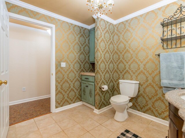 bathroom featuring vanity, tile patterned flooring, a chandelier, and toilet