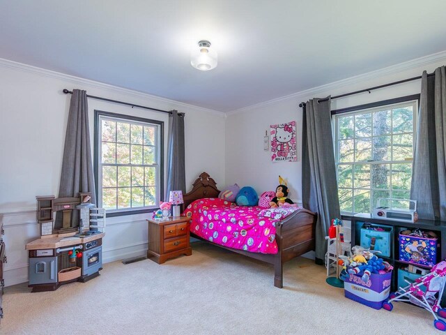 bedroom featuring crown molding and light carpet