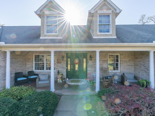 property entrance with covered porch