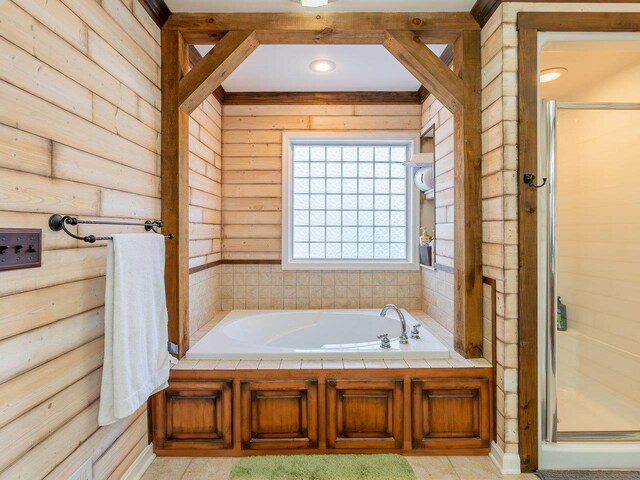 bathroom with shower with separate bathtub