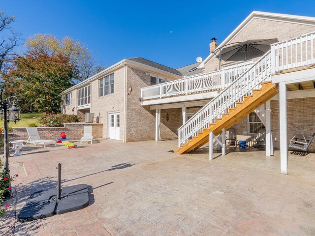 exterior space featuring central AC and a deck