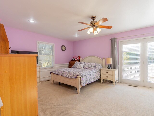 carpeted bedroom with access to exterior and ceiling fan