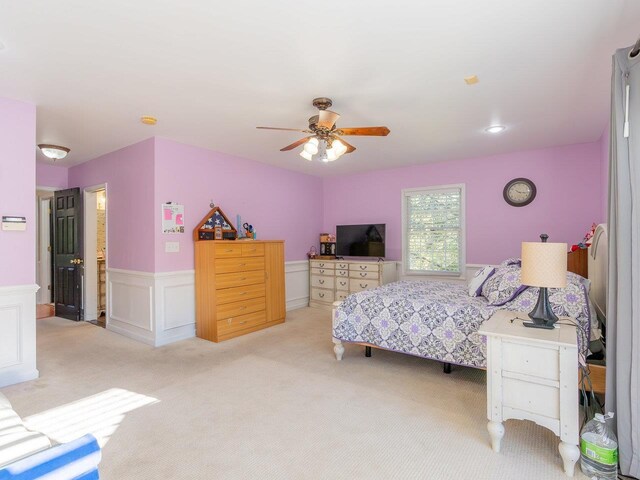 bedroom with light carpet and ceiling fan