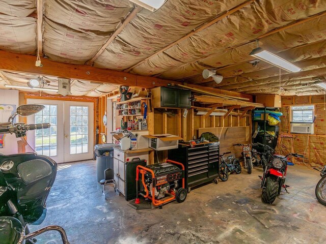 interior space with french doors, a wealth of natural light, and cooling unit