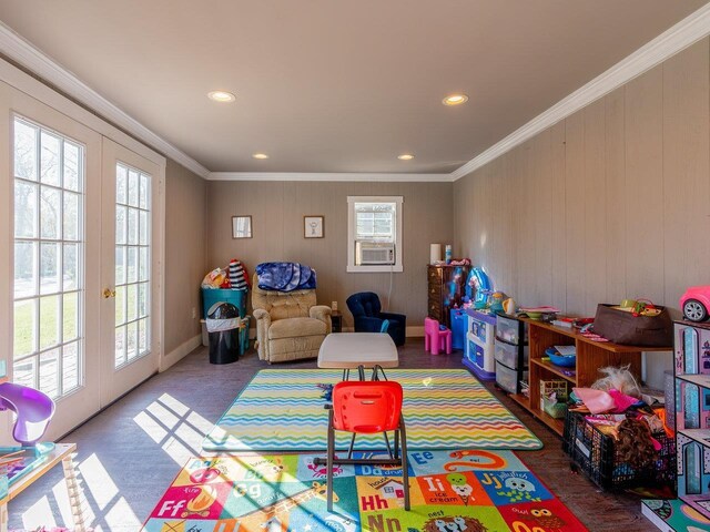 playroom featuring french doors, crown molding, and cooling unit