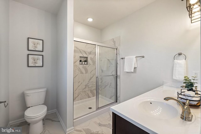 bathroom with a marble finish shower, baseboards, toilet, marble finish floor, and a sink