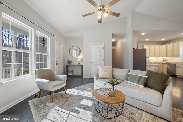 living room with vaulted ceiling, wood finished floors, and baseboards