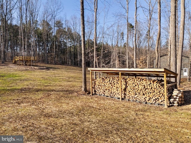 view of yard featuring a forest view