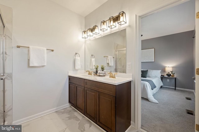 ensuite bathroom featuring baseboards, ensuite bath, a stall shower, a sink, and marble finish floor