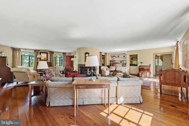 living area featuring a fireplace and hardwood / wood-style floors