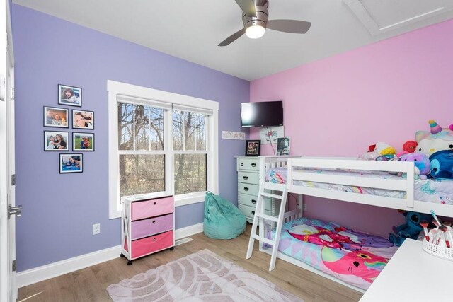 bedroom featuring ceiling fan and light wood-type flooring