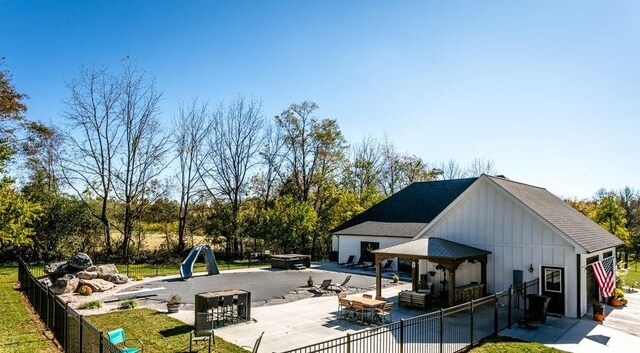 view of swimming pool featuring an outdoor fire pit and a patio area