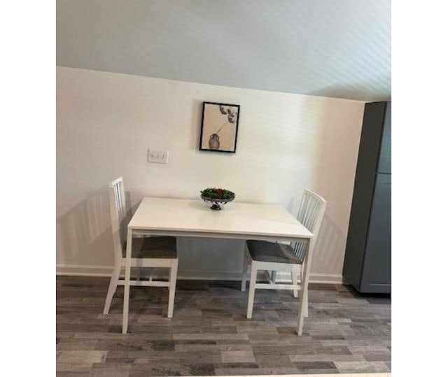 dining area with dark hardwood / wood-style floors