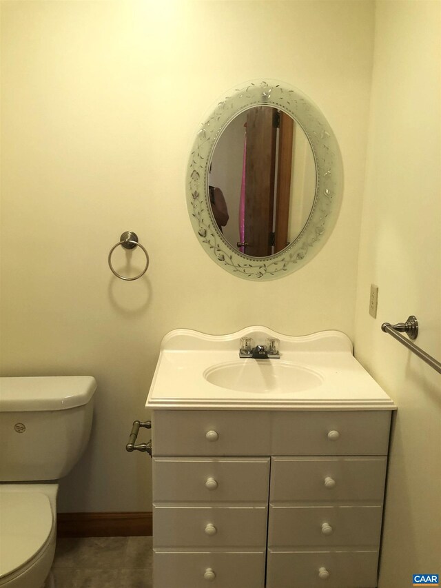 bathroom featuring vanity and toilet