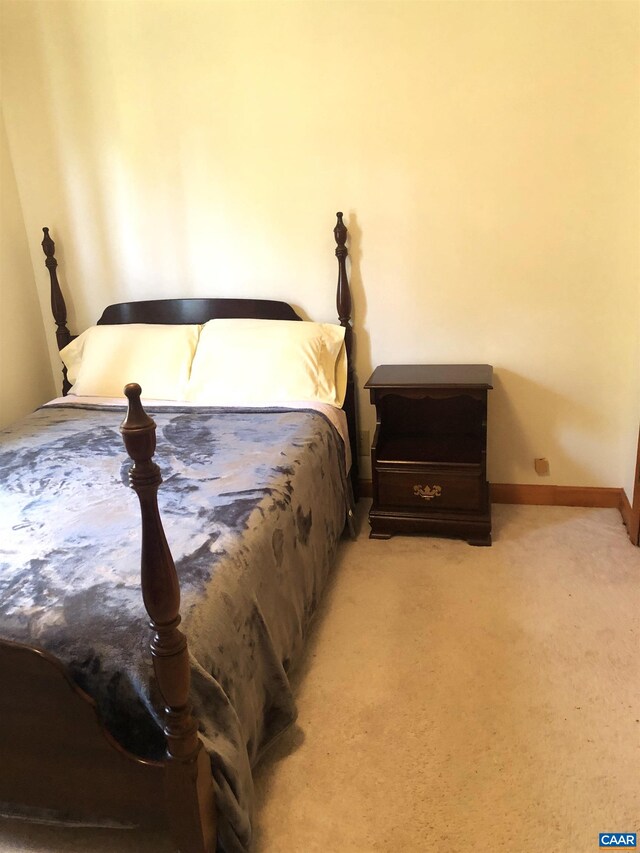 bedroom with light carpet