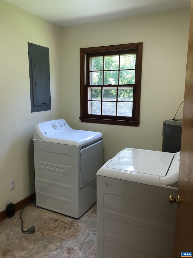 laundry area with washing machine and clothes dryer and electric panel