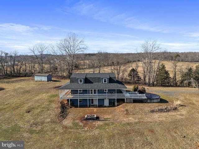 birds eye view of property with a rural view