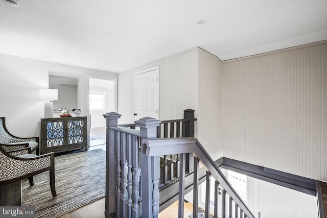 hallway with hardwood / wood-style flooring