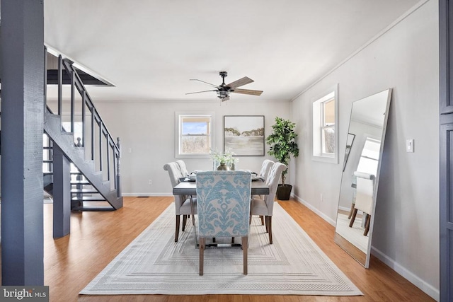 dining room featuring hardwood / wood-style flooring and ceiling fan