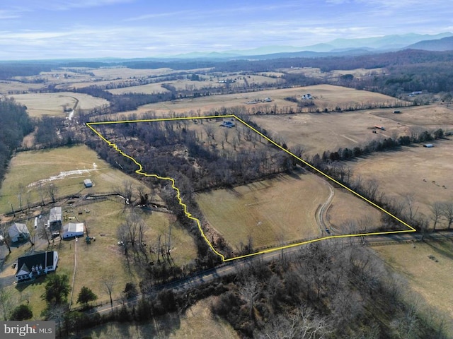 birds eye view of property featuring a mountain view and a rural view