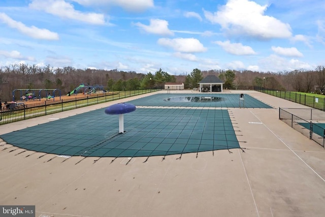 view of swimming pool with a patio, a gazebo, fence, and a fenced in pool