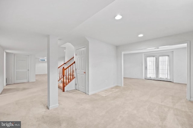 interior space with carpet, stairway, baseboards, and recessed lighting