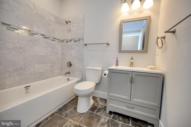 full bath with shower / bathtub combination, vanity, toilet, and baseboards