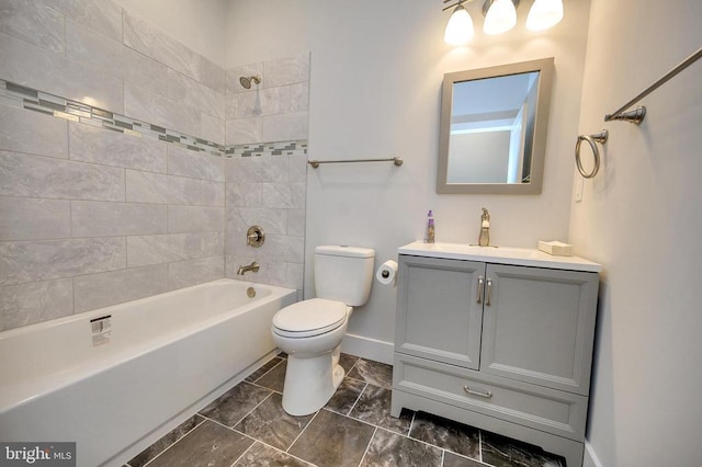 full bathroom featuring toilet, baseboards, shower / washtub combination, and vanity