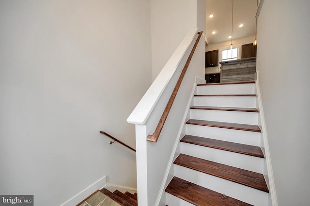 staircase with recessed lighting and baseboards