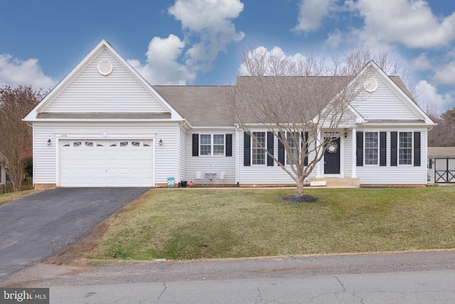 ranch-style house featuring a garage and a front lawn