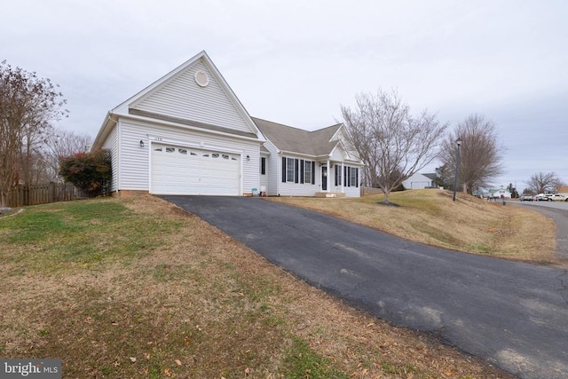 single story home featuring a garage and a front yard