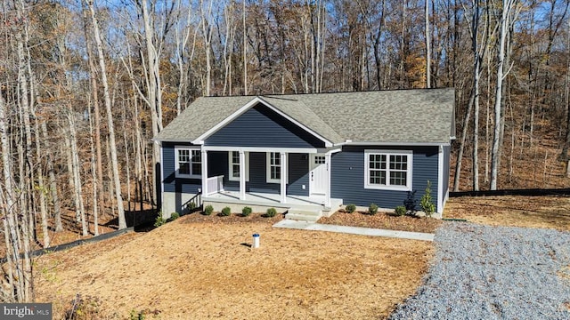 single story home with a porch