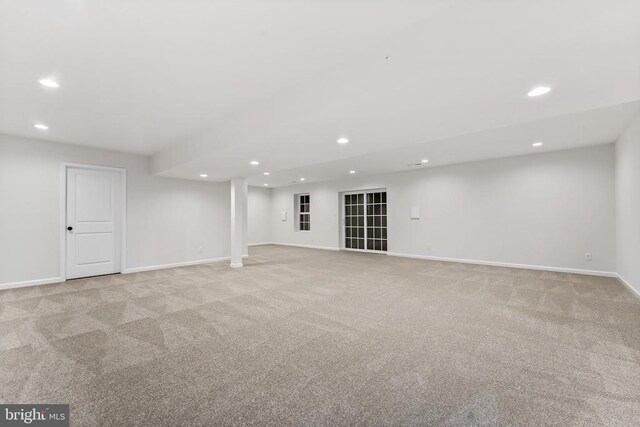 basement with light colored carpet